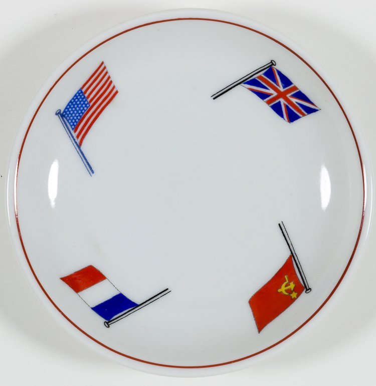 "BIG FOUR" CUPCAKE PLATE: "BIG FOUR" CUPCAKE PLATE Fine china cupcake plate, 4" in diameter, decorated around the rim with the flags of Britain, France, the United States, and the Soviet Union. The base is marked "Furstenberg"