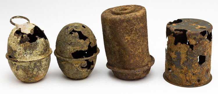 STALAG LUFT III GRENADE RELICS: STALAG LUFT III GRENADE RELICS Lot of four German hand grenades, excavated from the site of Stalag Luft III. Includes: two Model 39 "eihandgranate" ("Egg Hand Grenade"), 3" x 2 1/4", one with its carr
