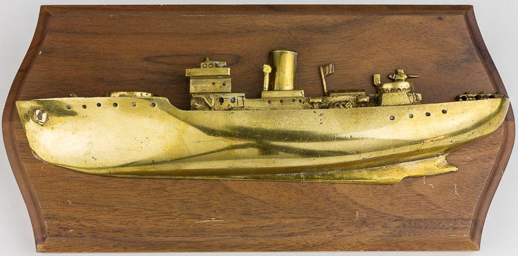 BRONZE ARMED MERCHANT SHIP WALL PLAQUE: BRONZE ARMED MERCHANT SHIP WALL PLAQUE Excellent cast bronze half-hull model of an armed merchant vessel, undoubtedly made aboard ship or in a shore-side machine shop. The 9 1/2" casting shows the ves