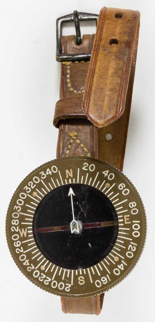 CORP OF ENGINEERS WRIST COMPASS: CORP OF ENGINEERS WRIST COMPASS An interesting piece of trusted WWII relic field gear, a Corp of Engineers wrist compass. Measures 56mm diameter with leather strap, a Superior Magnetic Corp. model mad