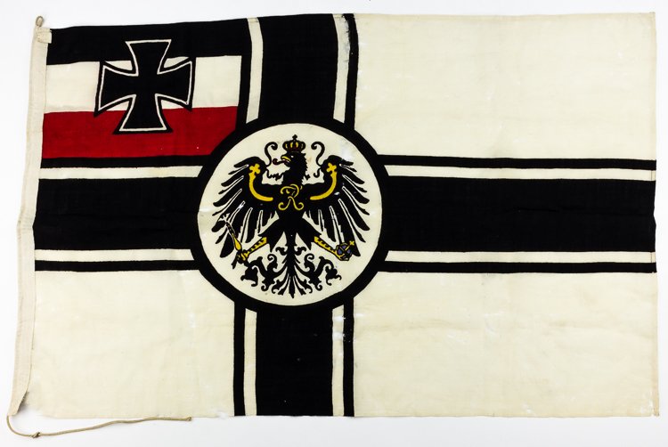 IMPERIAL GERMAN WAR ENSIGN: IMPERIAL GERMAN WAR ENSIGN War ensign of Imperial Germany, 32" x 48", dyed wool with a canvas reinforced hoist which still bears the original maker's tag from "Nestler's Fahnenfabrik, Bonn", and paper