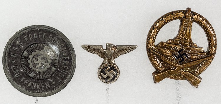 N.S.D.A.P. STICKPINS: N.S.D.A.P. STICKPINS Lot of three Nazi Party-related stickpins. Includes: a composite "Kraft durch Freude" stickpin, approx. 1" dia., with a1 1/2" pin, bearing the KdF insignia with the inscription; "