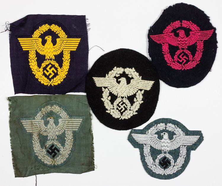 THIRD REICH POLICE SLEEVE PATCHES: THIRD REICH POLICE SLEEVE PATCHES Group of five cloth Third Reich police patches, each displaying a different color combination, indicative of a specific branch. Includes: Fire-Police insignia, 3 3/4"