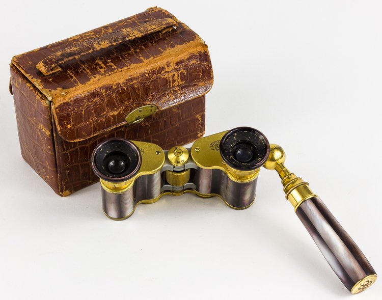 EVA BRAUN'S OPERA GLASSES: EVA BRAUN'S OPERA GLASSES Eva Braun's opera glasses, a very high-quality pair of optics manufactured by Carl Zeiss. The 3 x 13.5 glasses themselves are decorated in mother of pearl with set onto a pol