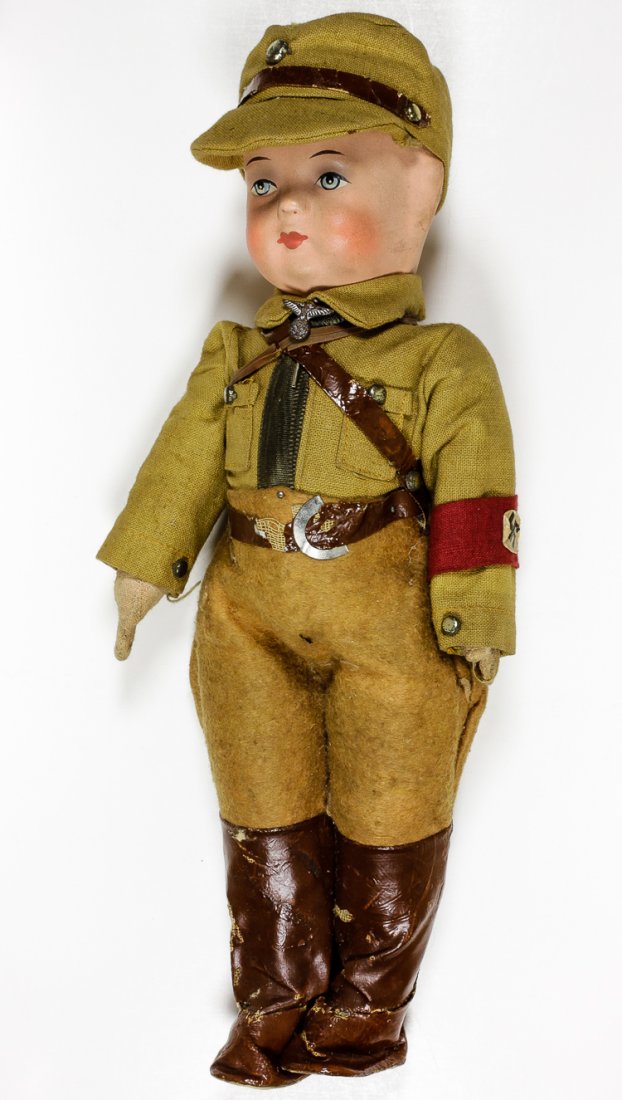 S.A. UNIFORMED DOLL: S.A. UNIFORMED DOLL German-made doll depicting an S.A. man, or "storm trooper", 10 1/2" tall with complete uniform including Nazi Party stick pin set at the neck, Nazi Party arm band, cap, boots, belt