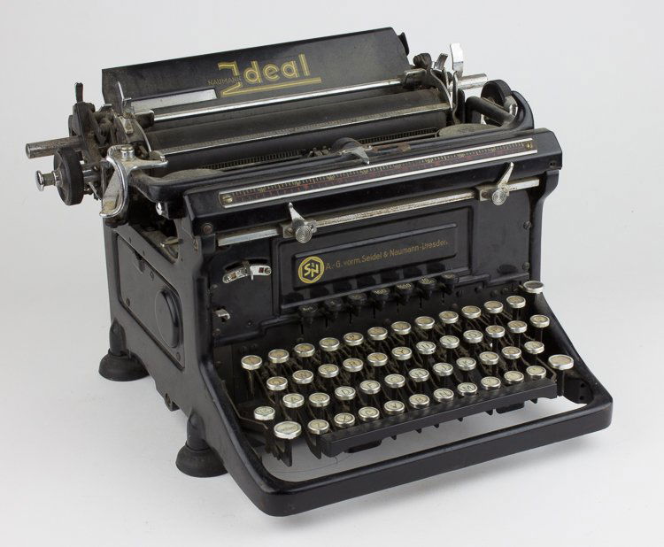 THIRD REICH SS TYPEWRITER: THIRD REICH SS TYPEWRITER Desk model Third Reich-era typewriter, approx. 12 1/2" x 11" x 10", a "Naumann Ideal", manufactured by A.-G. vorm. Seidel & Naumann of Dresden. It is capable of taking a dual