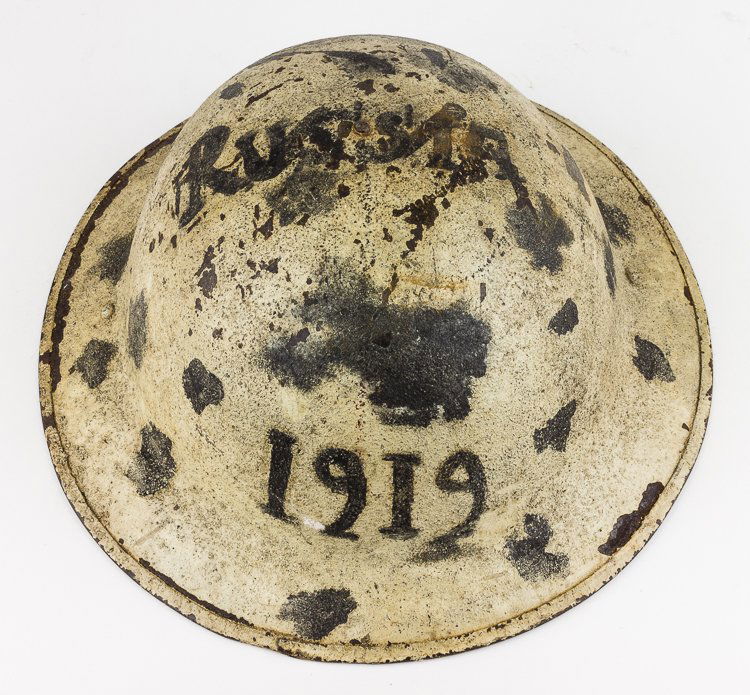 AMERICAN HELMET FROM 1919 SERVICE IN RUSSIA: AMERICAN HELMET FROM 1919 SERVICE IN RUSSIA Excessively rare American soldier's helmet worn by a doughboy during the "Polar Bear Expedition" in Russia from September 1918 through to July 1919. This st