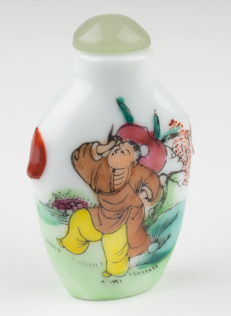 "DANCING MAN" SNUFF BOTTLE: "DANCING MAN" SNUFF BOTTLE White ceramic snuff bottle, 2 1/2" tall, painted on both sides with the image of a dancing man in yellow trousers. The bottle is sealed with a stopper capped with light gree