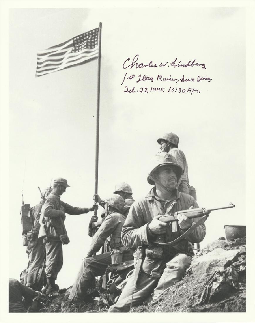 AMERICAN MILITARY NOTABLES: AMERICAN MILITARY NOTABLES CHARLES W. LINDBERG (1920-2007) Marine corporal, the first flag raiser at Iwo Jima. S.P., 8 ½" x 11", b/w, a photo of the first flag raising atop Mount Suribachi. Signed at