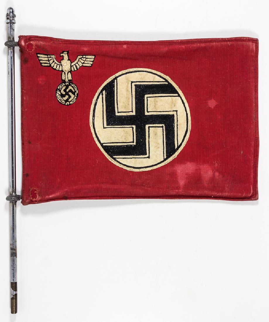 GERMAN STATE STAFF CAR FLAG: GERMAN STATE STAFF CAR FLAG Early German national staff car flag and chromed support pole. The two-sided embroidered flag measures 10 ½" x 7 ½" and displays embroidered static swastika and national 