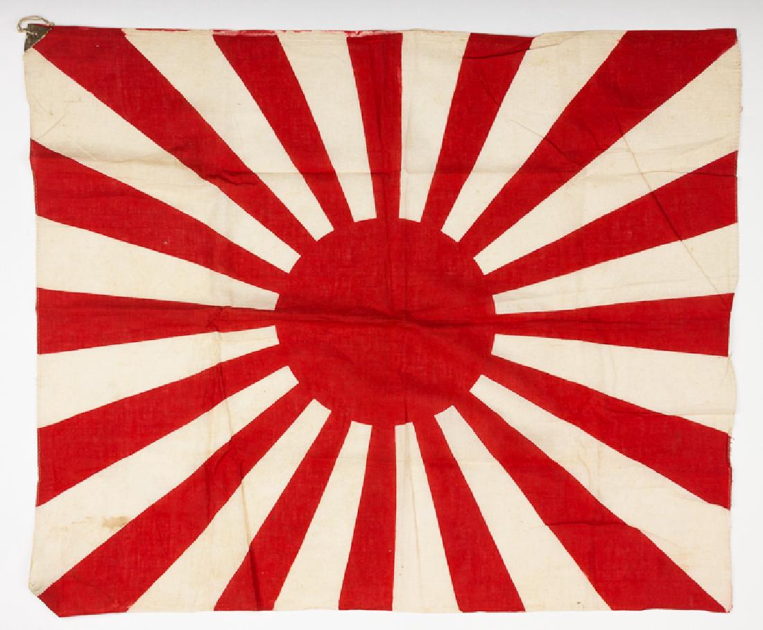 JAPANESE ARMY BATTLE FLAG: JAPANESE ARMY BATTLE FLAG Japanese army combat flag, 32" x 17" cotton depicting a sun and rays at the center, two reinforced tabs at the corners along the hoist with small ties, in fine condition.