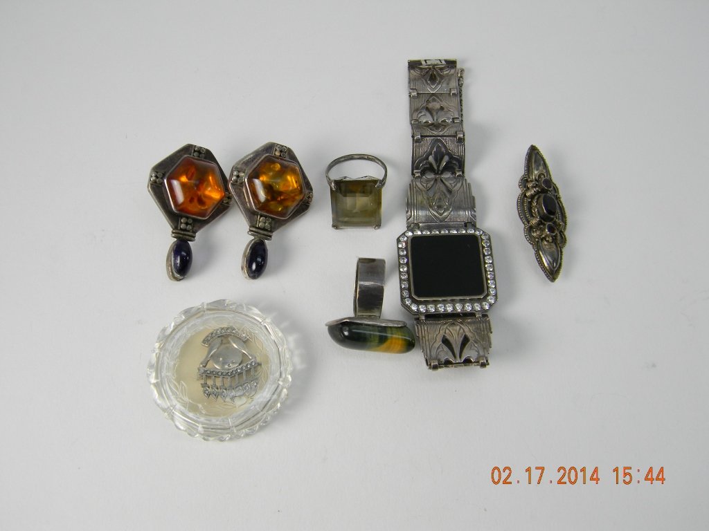 Assorted Lot Vintage Sterling Jewelry: Black onyx bracelet, pin with ruby colored stones, two rings with stones, pair of Lori Bonn earrings with amber and purple stones, sterling menorah and marcasite pin. _x000D_ Weight 83.3 grams
