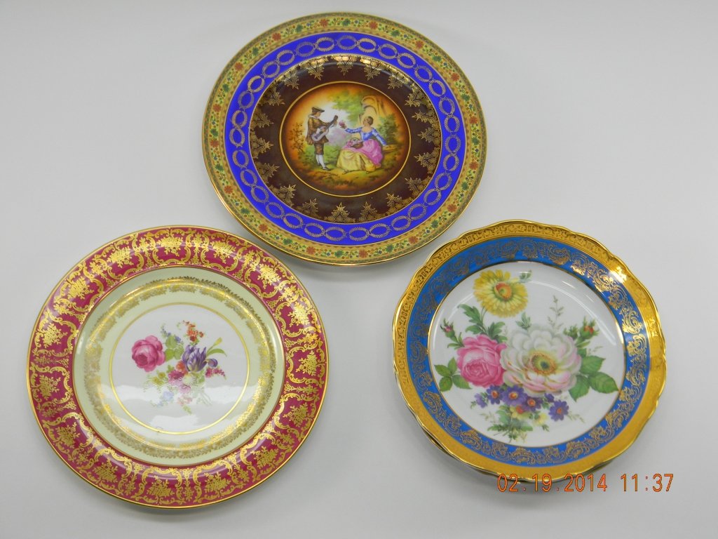 Lot of Limoge & Bavarian Plates: Two porcelaine French Limoges with floral designs and a blue and gold trim; 91/2" in diameter. Two Bavaria plates made in Western Germany with man seronading a lady and decorative blue and gold trims;