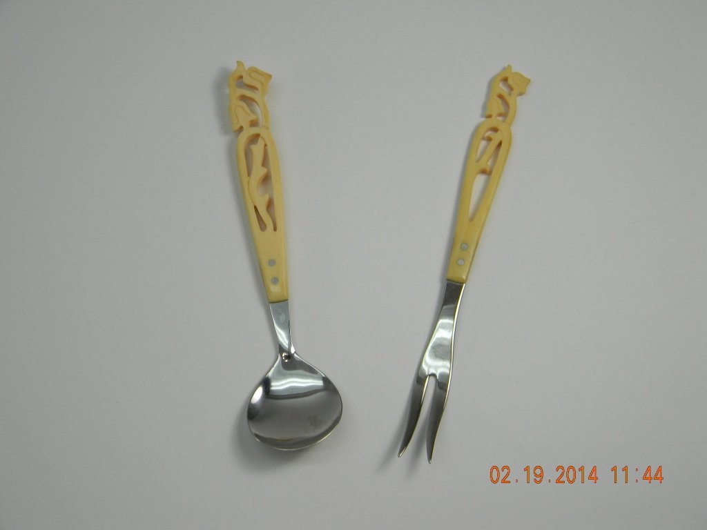 Vintage Danish Carved Handle Spoon & Fork: Two hand carved ivory type handled spoon and fork marked on the back Rustfri. Approximately 5'' long.