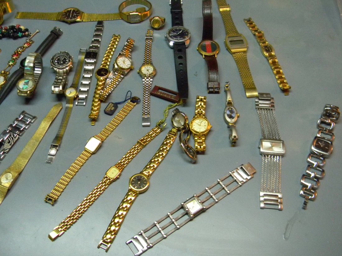 Large Lot of Designer Women's Watches: Mostly all women's and few mens watches includes: Anne Kleins, Guess, Stone, Anne West Buffalo, Varsales and more. 50 watches in all.