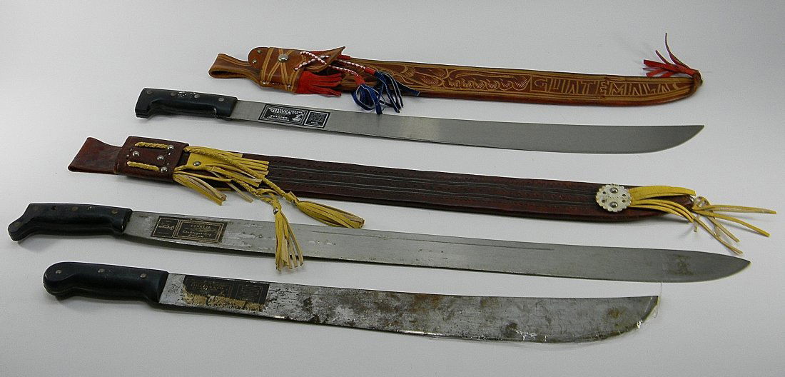 Lot of 3 Machetes With Sheaths: Lot of 3 Machetes. @ with sheaths. Approx 26'' L, 35'' L, 32'' L. There was a mistake on this lot that stated that there are 5 Machetes. 2 machetes are out of the sheaths with 1 machete that has no sh
