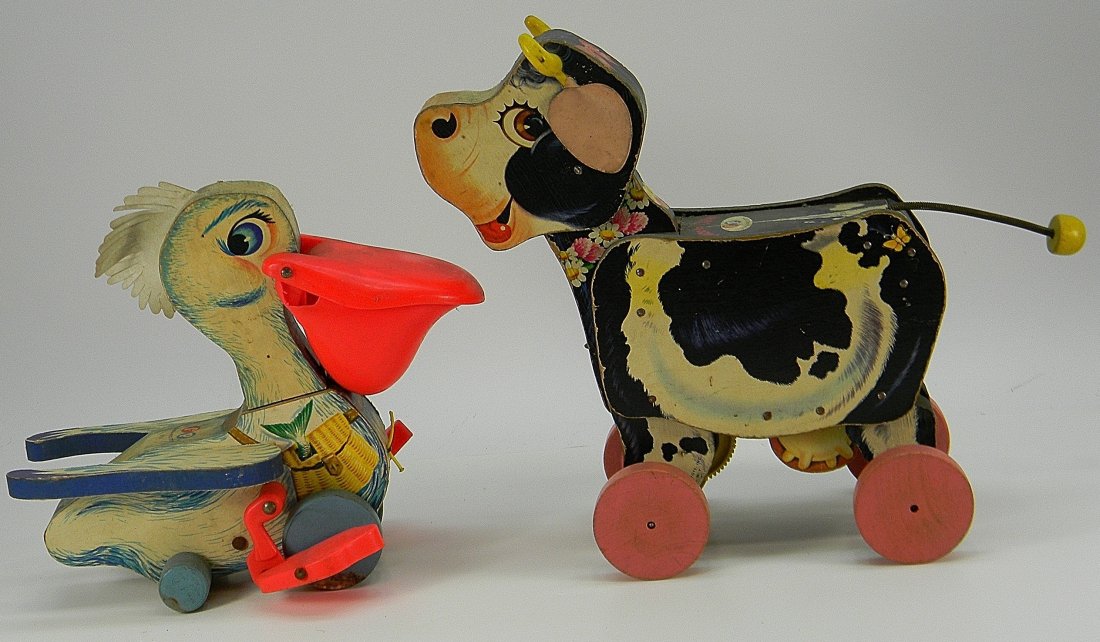Lot of Fisher Price Wooden Roller Toys: Lot of Wooden Roller Toys. Pelican approx. 8'' h. Cow approx. 12'' h. Used condition, no pull strings.