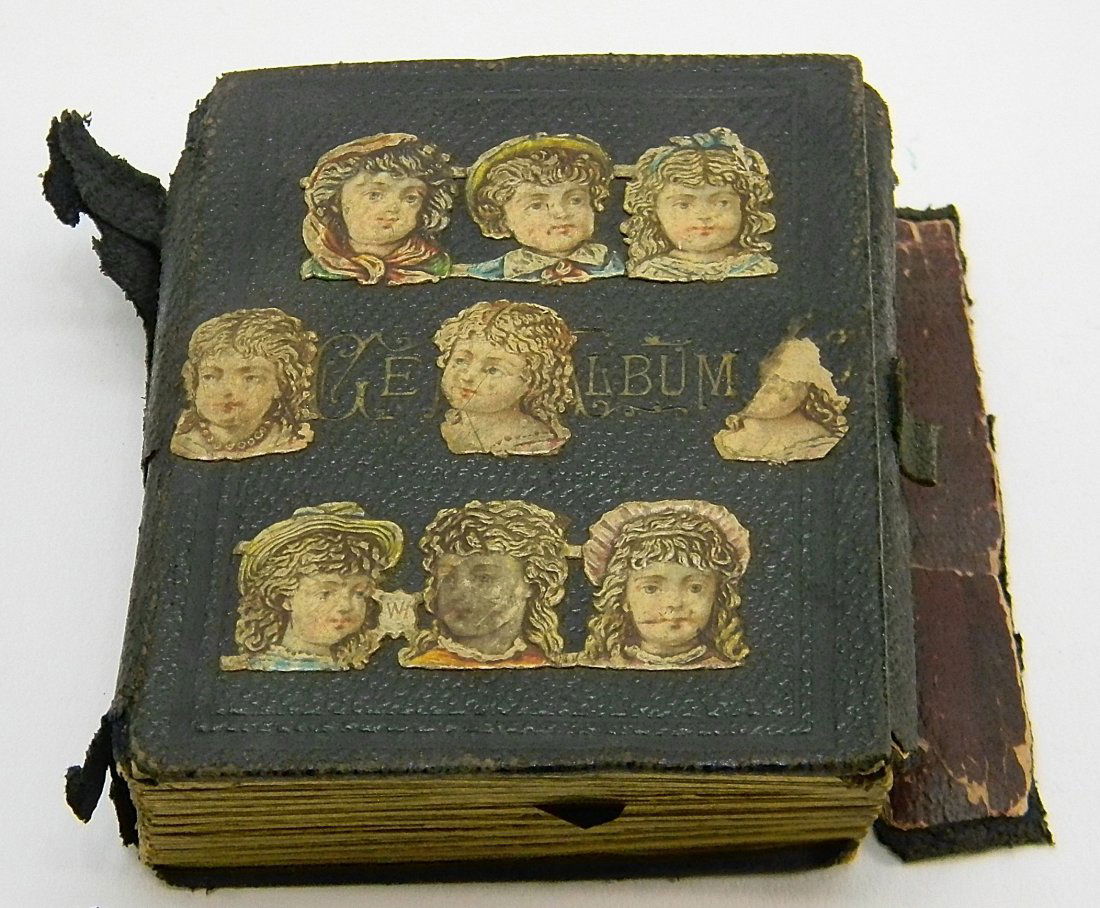 Victorian Tin Type Photo Album: Tin Type Photo Album. 88 tin photos. Approx. 1.5'' by 1.25''. Photos are good to fair condition, the album is leather and the covers are coming apart.