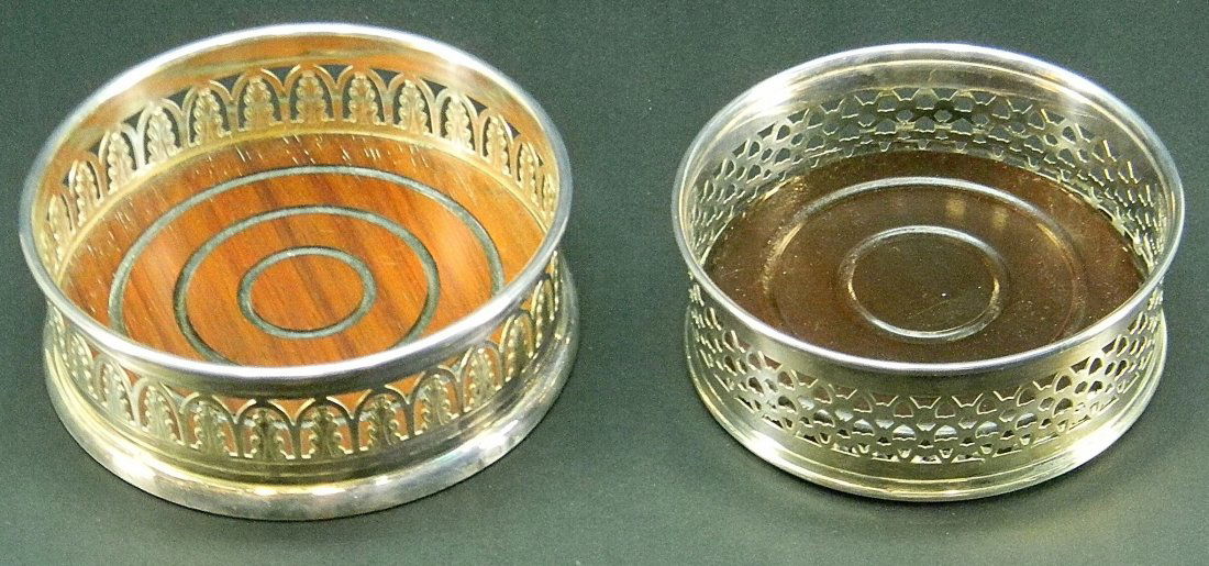 2 Pierced Silver & Wood Wine Bottle Coasters: 2 Pierced Silver Plated & Wood Wine Bottle Coasters. Approx. 2'' h.
