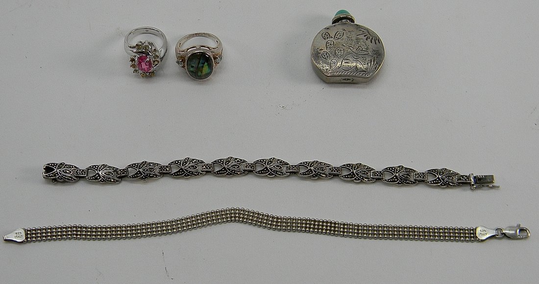 Lot 5 Sterling Silver Bracelets Rings Snuff Bottle: Lot includes: 1 Italian beaded and 1 signed "FAS" marcasite bracelets, 1 signed "RJ" w/ abalone ring, 1 pinkand clear stone ring and a mexican siesta scene snuff bottle w/ blue stone signed "RM". Weig