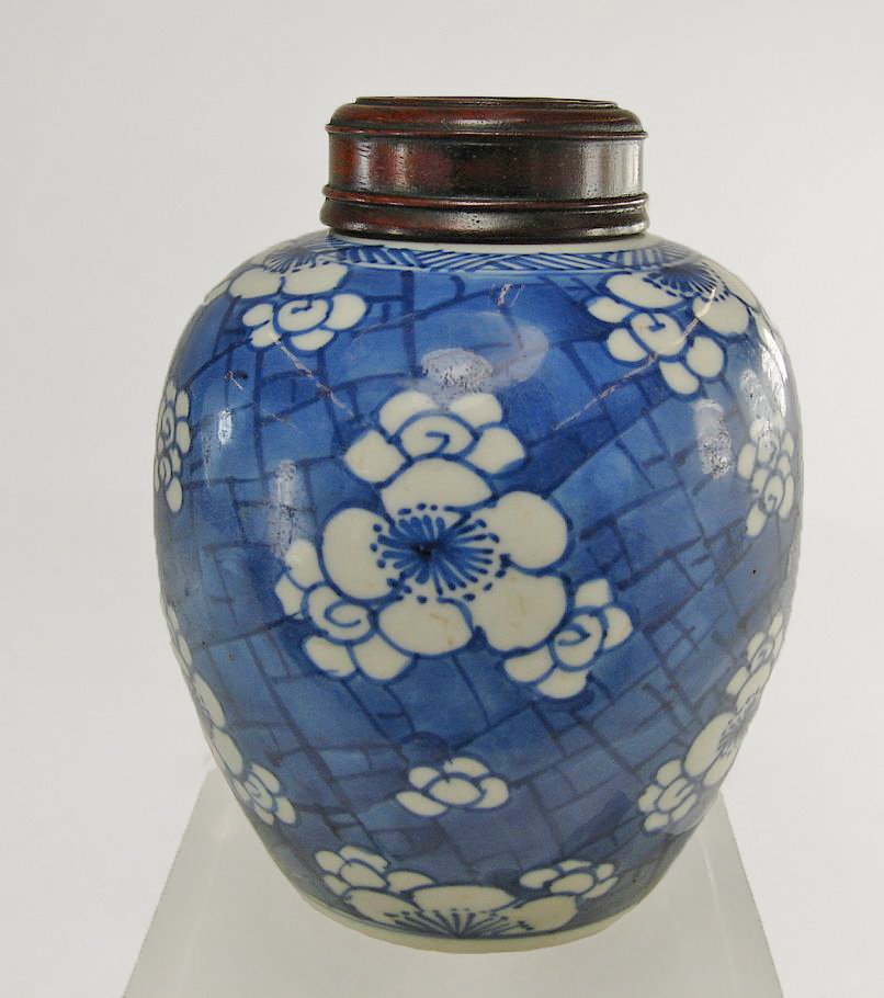 Chinese Underglaze Blue Prunus Ginger Jar Kangxi Style: Well painted Chinese underglaze Blue Ginger Jar with prunus decoration on a field of blue, with hardwood rosewood lid, probably 19th century.Height: 5 1/4 Inches (13.3 cm)Width : 4 Inches (10.5 cm)