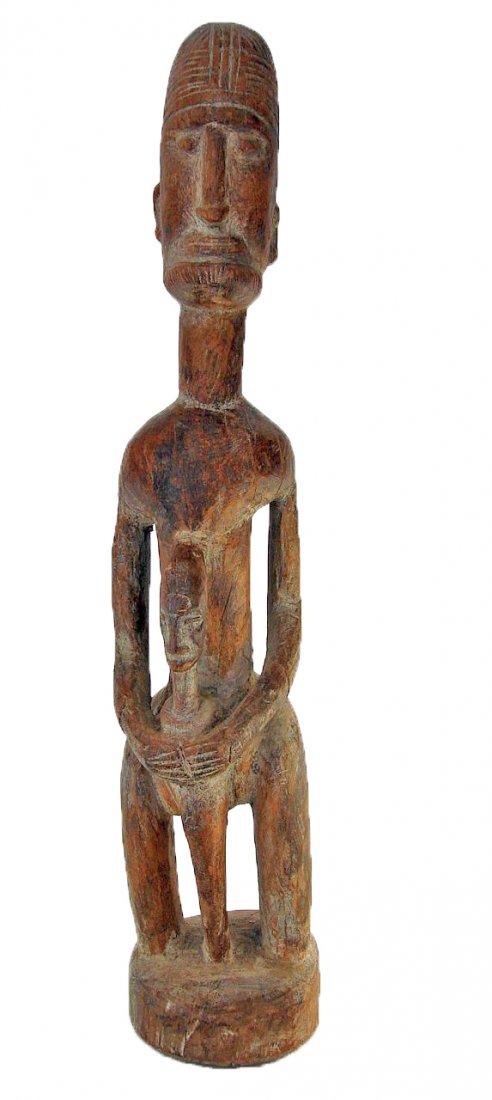 Old African Wood Carving of a Man with Child: Large African wood carving of a father and child. Early to mid 20th century Height: 23 1/4 Inches (59.0 cm)Width : 4 1/2 Inches (11.5 cm)