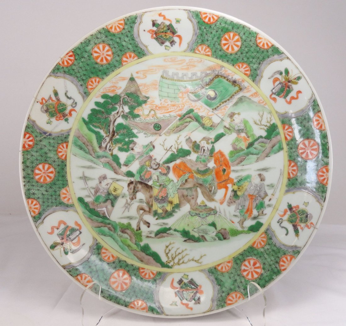 Important Kangxi Famille Verte Charger Reign Mark: Important Kangxi Famille Verte Charger with well painted historic scene of a battle, the charger was broken and repaired with more staples than we have ever seen, the repair took considerable time and