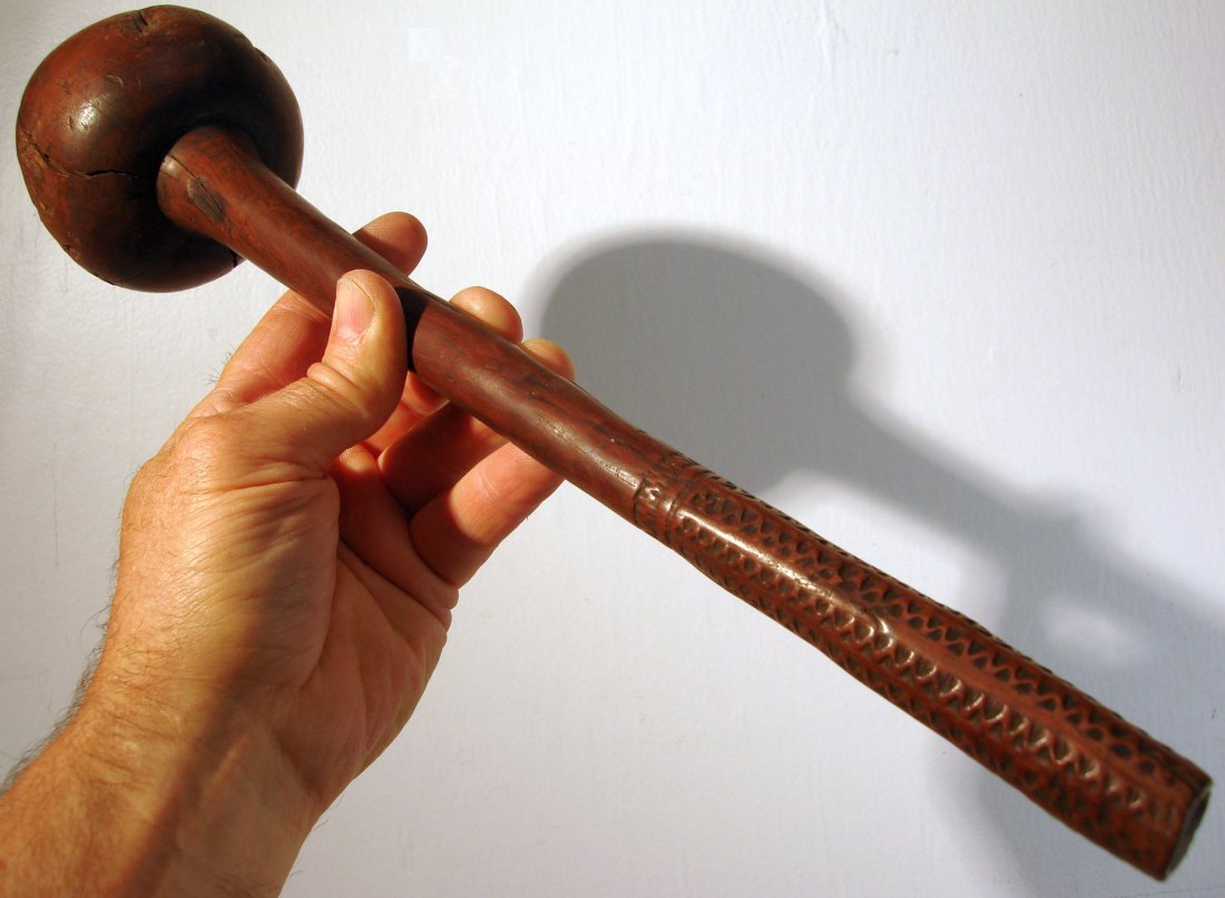 18th / 19th Century Ula. Carved Throwing Club from Fiji: Carved handled Ula or throwing club from Fiji Islands.Dense hardwood weapon with dry original surface with worn zigzag carved handle.length 41 cm ( 16 1/4 inches)weight 600 grams ( 1 pound 5 ounces)
