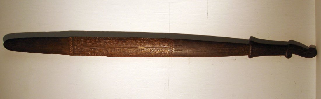 Patu. Carved Inlaid Weapon from Trobriand Islands PNG: Carved and lime inlaid ,straight grained dark hardwood weapon. 19th or very early 20th century.length 81.7 cm ( 32 1/4 inches)