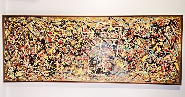 Mid Century Modern Jackson Pollock Style Drip Painting: Interesting Mid Century modern drip painting in the style of Jackson Pollock, unsigned. Bright Yellow blue white red and black colors on board. Width 48 3/4 Inches (124.0 cm) Height 18 5/8 Inches (47.