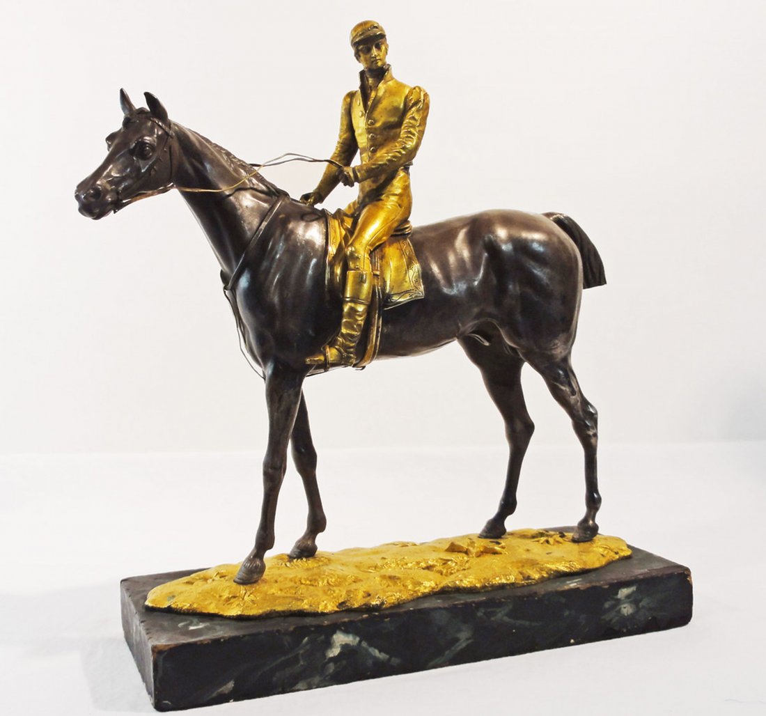 Horse & Rider Silvered Bronze & Fire Gilt ca. 1820: Fine early silvered and fire gilt bronze of a horse and rider. Beautifully cast bronze of a jumping or racing horse and his rider. Mounted on a faux marble, painted wooden base. Height: 12 Â½ Inches