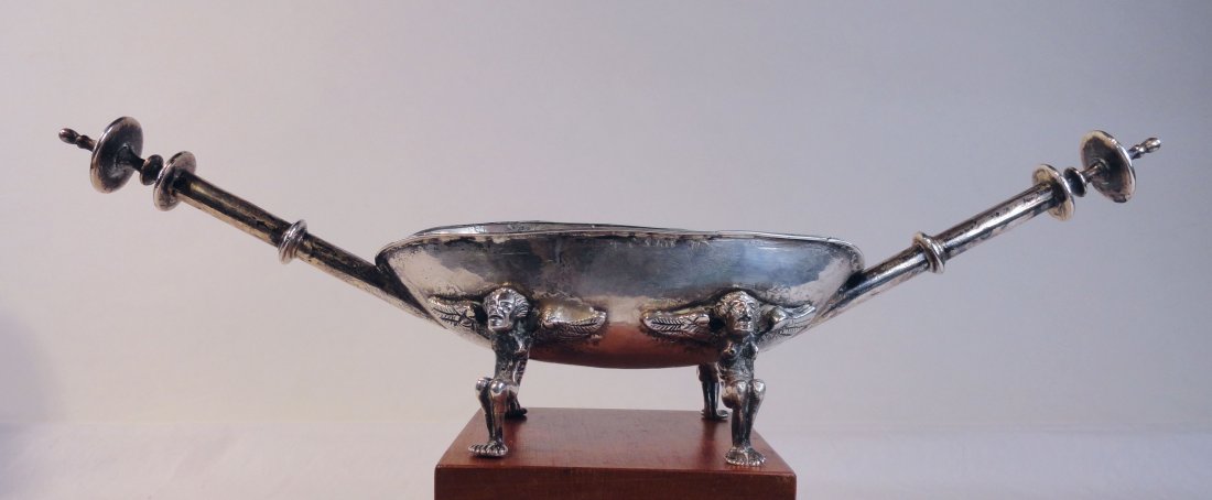 Spanish Colonial Silver Brazier Hallmarked Braserillo: Heavy ,early Spanish colonial silver braserillo (Brazier) table lighter supported by four crouching angels, and two long handles. The brazier has 3 hallmarks, one that appears to read dvd, and two oth