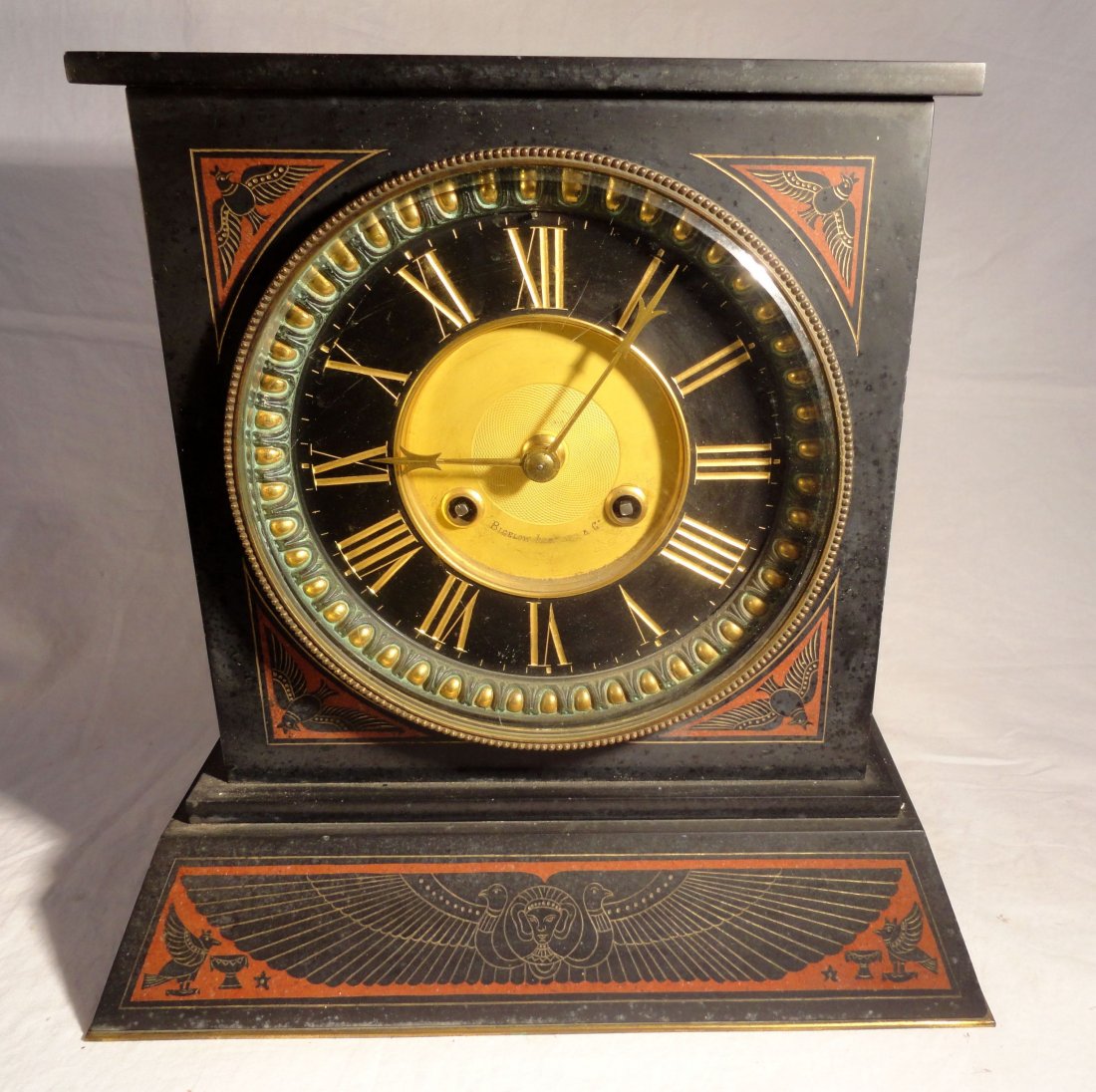 Egyptian Revival Mantle Clock Bigelow Kennard Clock Co.: Mantle clock done in an Egyptian revival style featuring Egyptian pictorials surrounding the beautiful, clean clock face, which is signed Bigelow Kennard & Co. Boston. This is the type of clock often 