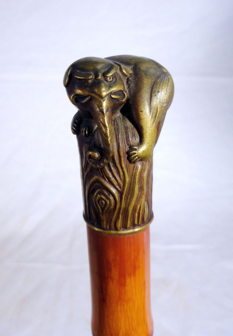 Antique Cane Signed Meiji Bronze Elephant Baku Top: Very rare, late 19th century Japanese bronze headed bamboo cane with fine bamboo shaft and original ferrule. The bronze head of the cane is a mythical figure of a Baku,elephant like but with prominent