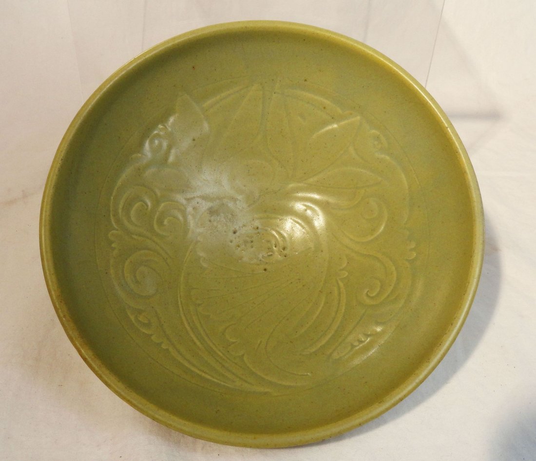Chinese Song or Jin Celadon Incised Bowl Yaozhou: Rare late Northern song dynasty, or early Jin dynasty bowl, with celadon glaze hand carved floral pattern featuring a lotus flower and a leaf in a circular design on the interior of the bowl.The outsi