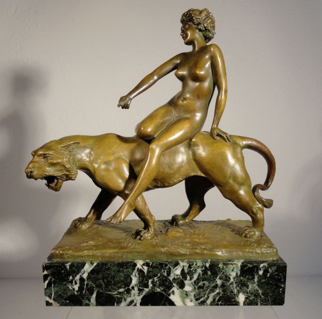 French Bronze Paul Philippe Nude Woman on a Lion: Late 19th/ early20th century, finely cast bronze by famed sculptor Paul Philippe, of a nude beauty, attempting modesty atop a snarling, stalking panther in a neoclassical style. The bronze is signed P