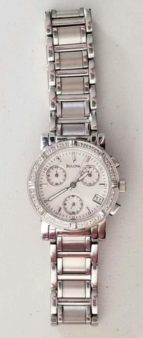 WOMANS BULOVA DIAMOND BEZEL STAINLESS WATCH: GOOD CONDITION, NEEDS BATTERY