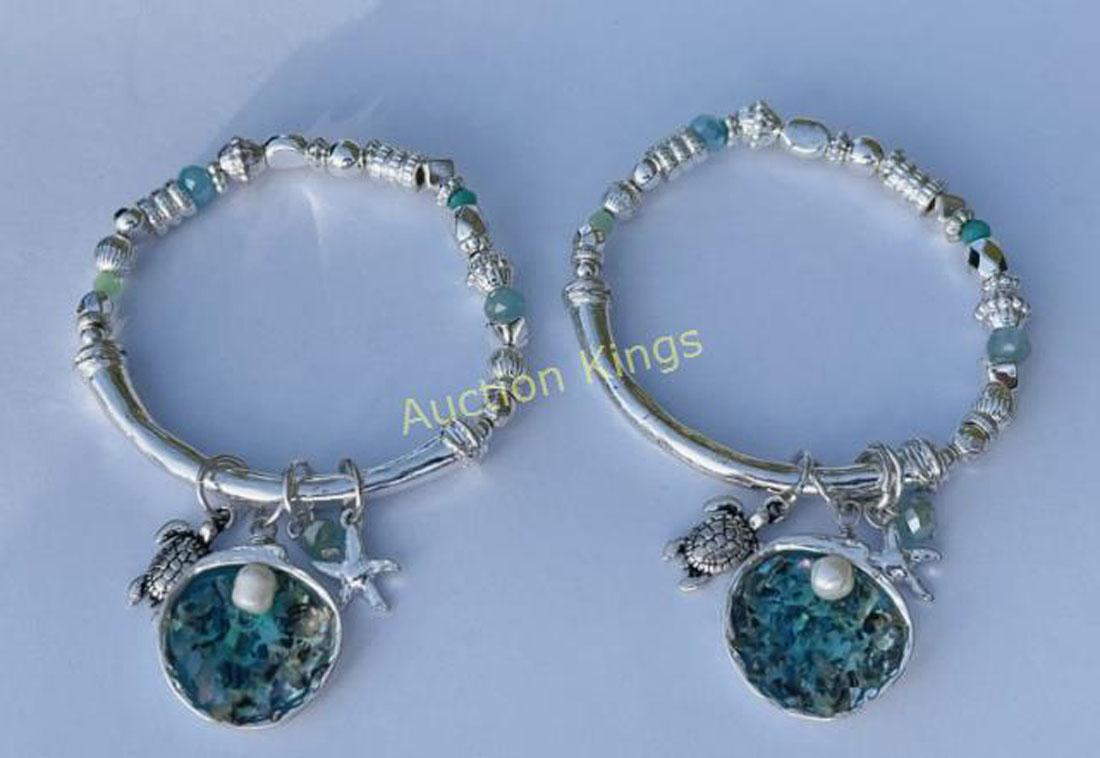 LOVELY LOT OF 2 PEARL OYSTER CHARM BRACELETS: SILVERTONE