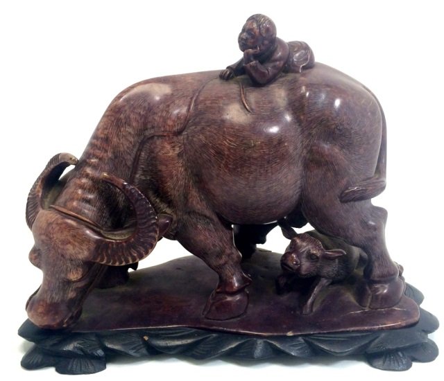 ASIAN CARVED SOAPSTONE BULL FIGURINE ON STAND: 8"ACROSSX7"H