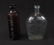 Pair of Advertising Bottles