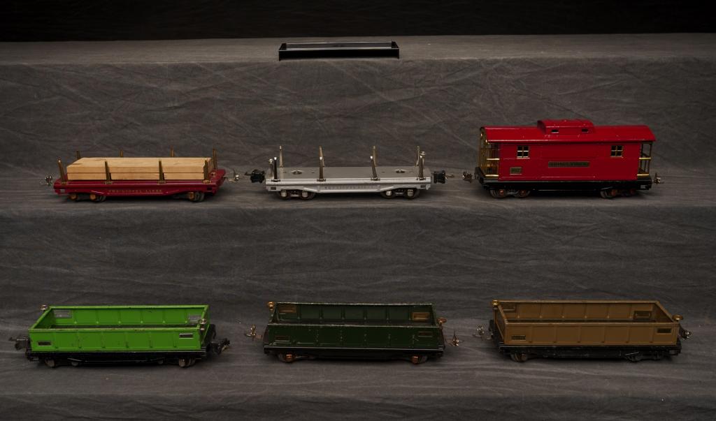 Miscellaneous Lot of Early Lionel Cars.: Lot to include 811 flat car, three 812 gondola, 817 caboose, 811 flat lumber. 817 & 811 restored.