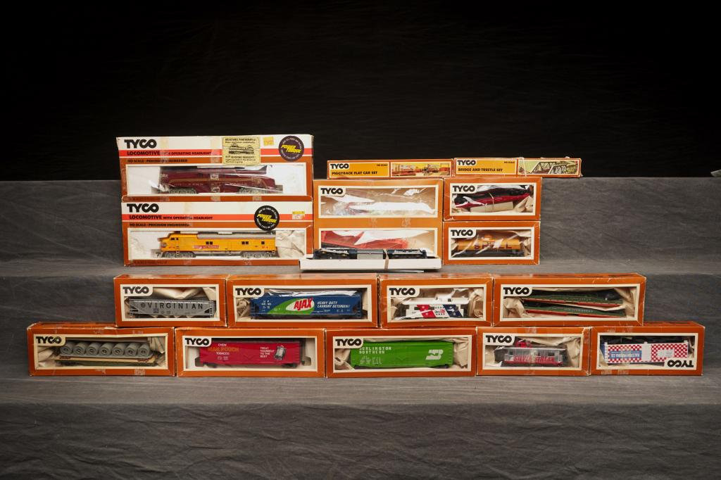 Large Lot of Tyco HO Engines & Train Cars.: Lot includes GG1, Union Pacific diesel, many train cars and accessories, most in the original boxes. All appear to be in good above average condition. Boxes with wear.