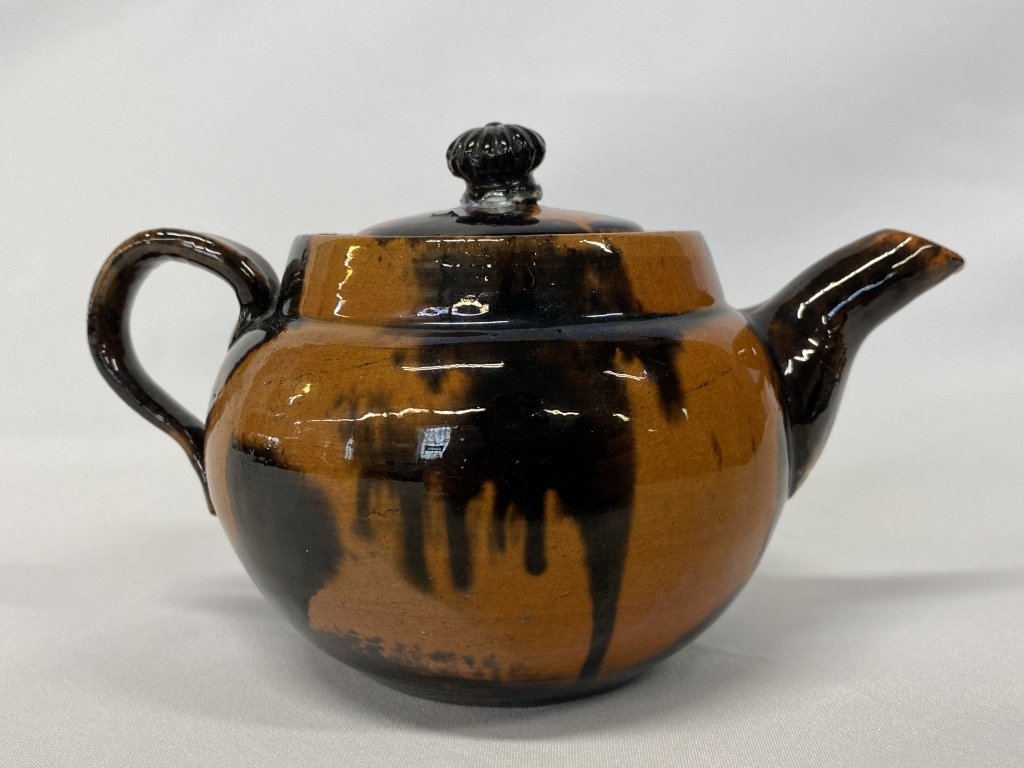 Early redware pottery child’s teapot. (1 of 4)