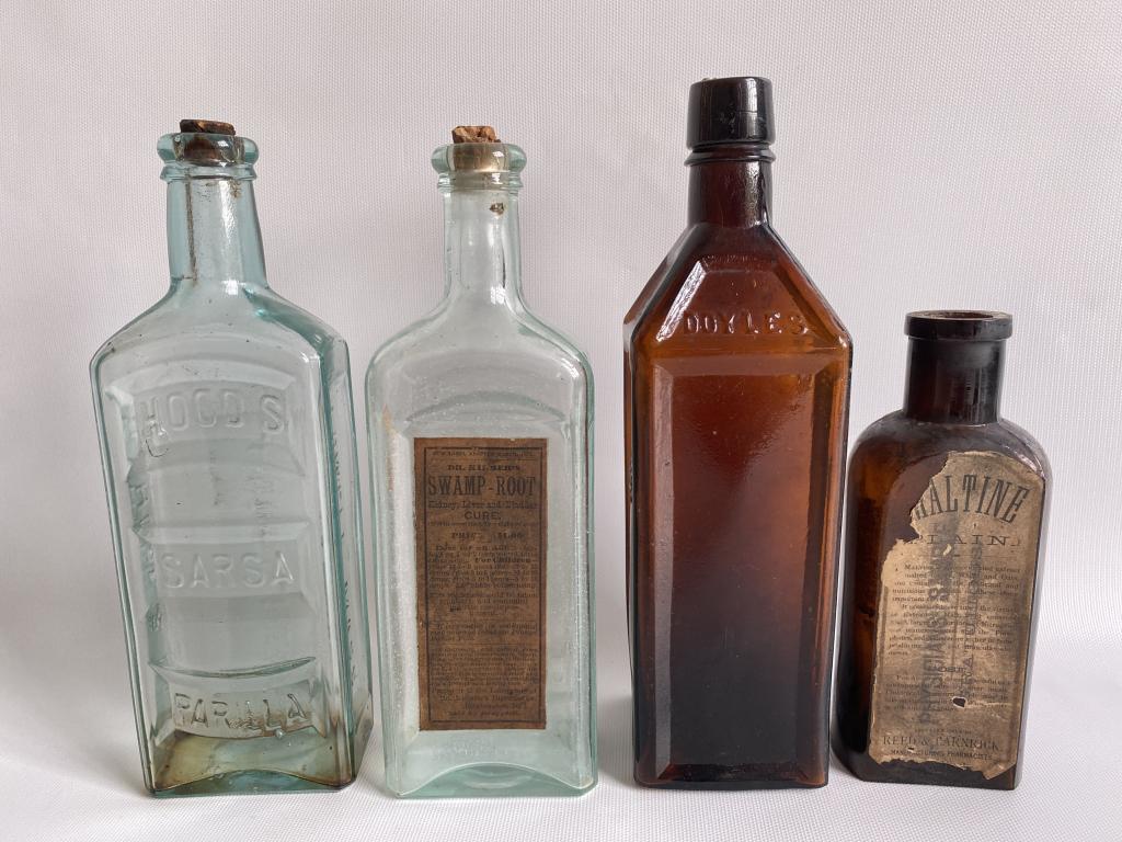 Set of 4 antique bottles. (1 of 10)