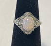 10K filagree ring with opal stone Approx size 3.5.