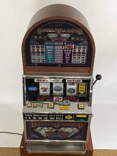 Double Diamond Deluxe slot machine. 47” high plus base: 47” high plus base which measures approximately 22". Set of keys included and in good working condition.