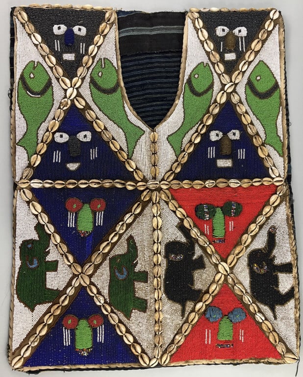 West African Ceremonial Beaded Sango Vest.: 27"Lx20"W. Early 20th century. Nigerian Yoruba polychrome beaded ceremonial vest with elephant and fish design, framed in diamond and triangular geometric cowrie shell borders. Striated period cotton 