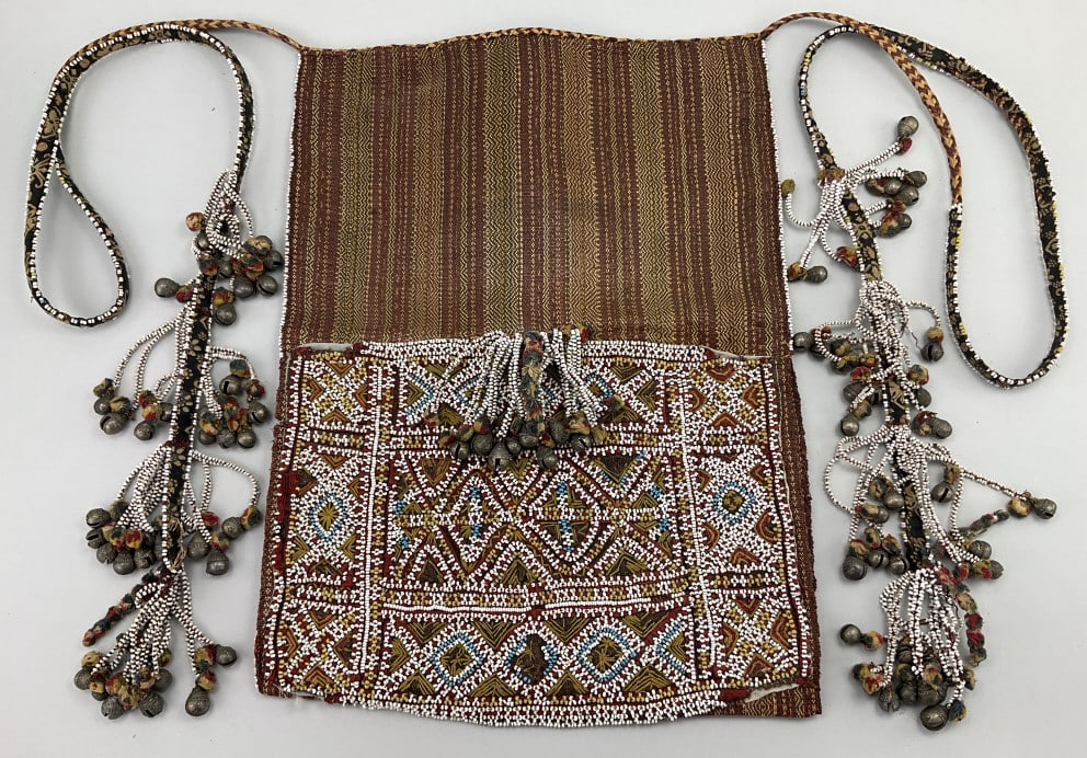 Vintage Beaded Ceremonial Tribal Kabir.: 17"Lx13"W. Early 20th century Bagobo man's carrying bag from the Philippines. Manila hemp woven abaca pounded fibers with bead decoration and ikat-dyed textile with cowrie shell adornments. Condition: