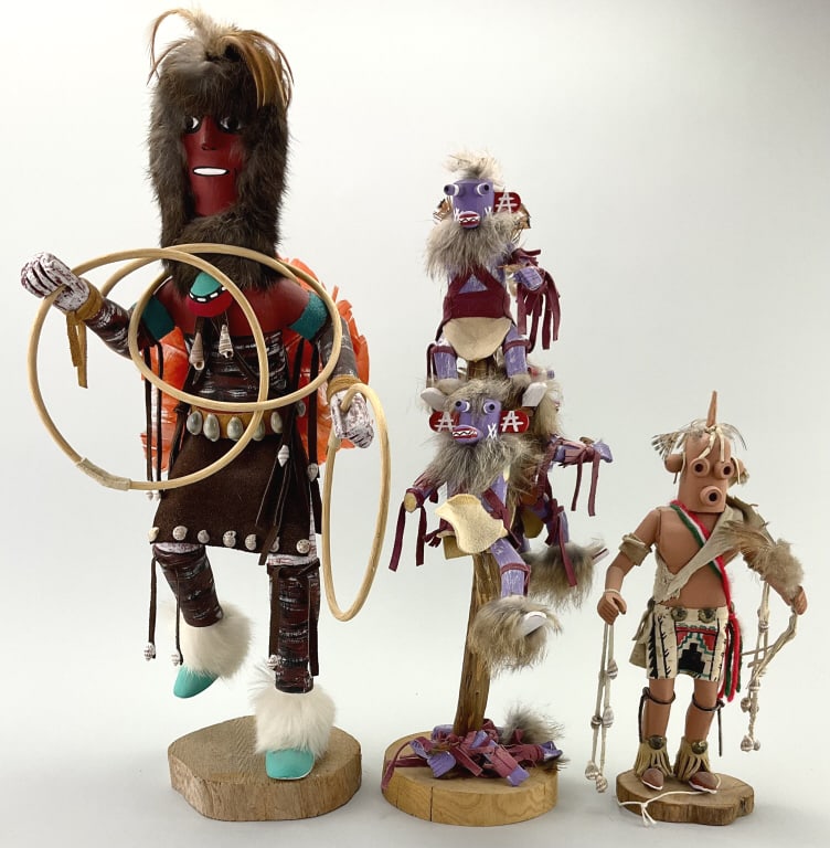 3 Traditional Kachina Dolls.: 12-19"H. Including hoop dancer and mud head. Figures representing spiritual beings integral to the Hopi and Pueblo cultures. Condition: Good with minor loss and wear. **LOCAL PICKUP MUST BE BY APPT ON