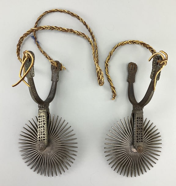 Pair of Antique Chilean Huaso Spurs.: 10"L. Late 19th century, filigree and filed silvered steel with large spiky rowels. Good with minor use wear. **LOCAL PICKUP MUST BE BY APPT ONLY POST AUCTION ONLY ON SPECIFIC DATES:CALL 717-272-7078 